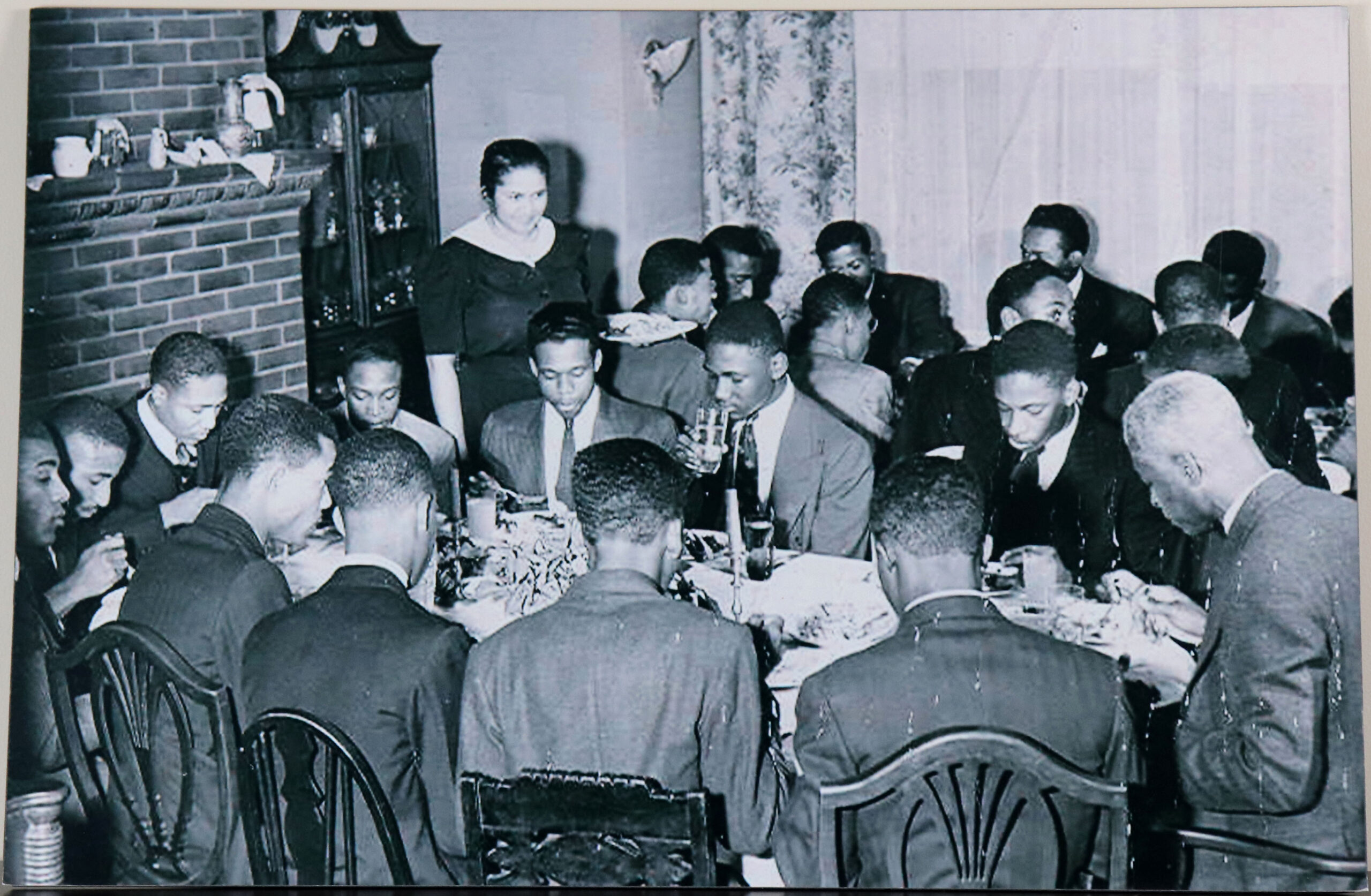 A Group of Men Sitting at a Table, circa 1955